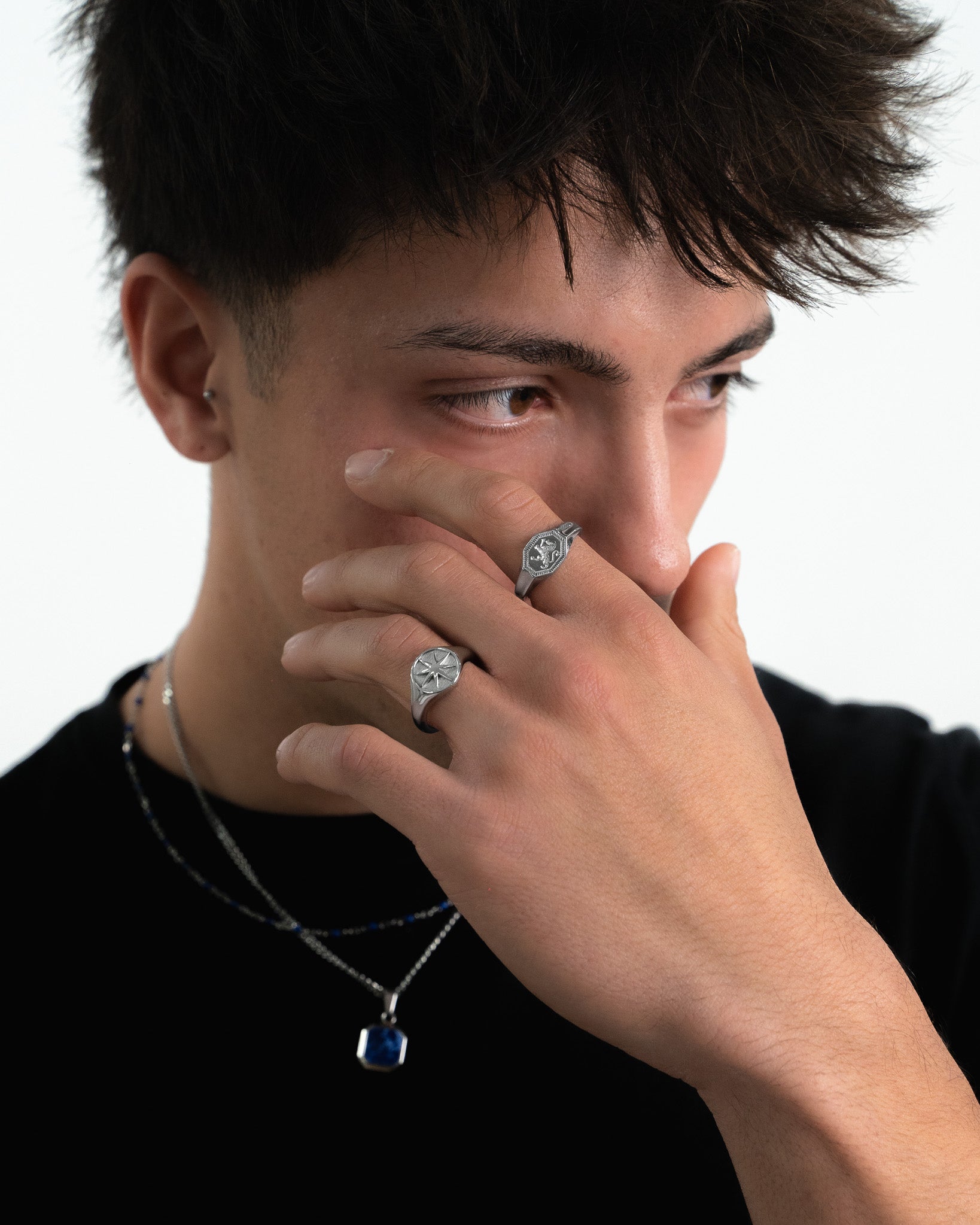 Legacy Silver Ring featuring a starburst pattern on a round face worn on the finger