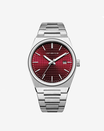Close up of a silver AUREN watch with a red textured dial and metal bracelet.