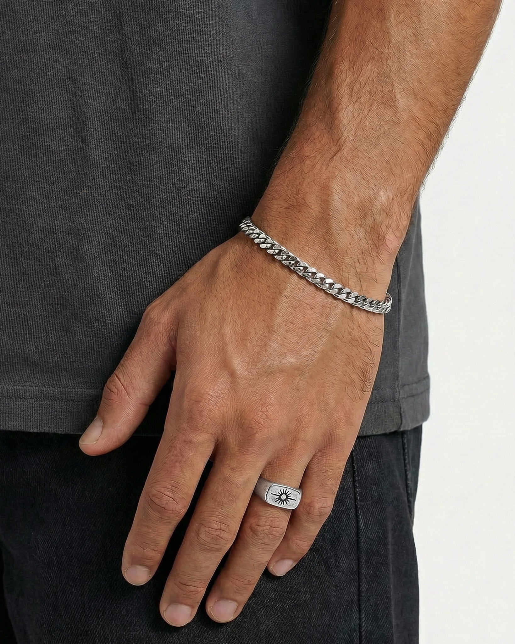 Close-up of Horizon Silver Ring on finger showing sunburst design
