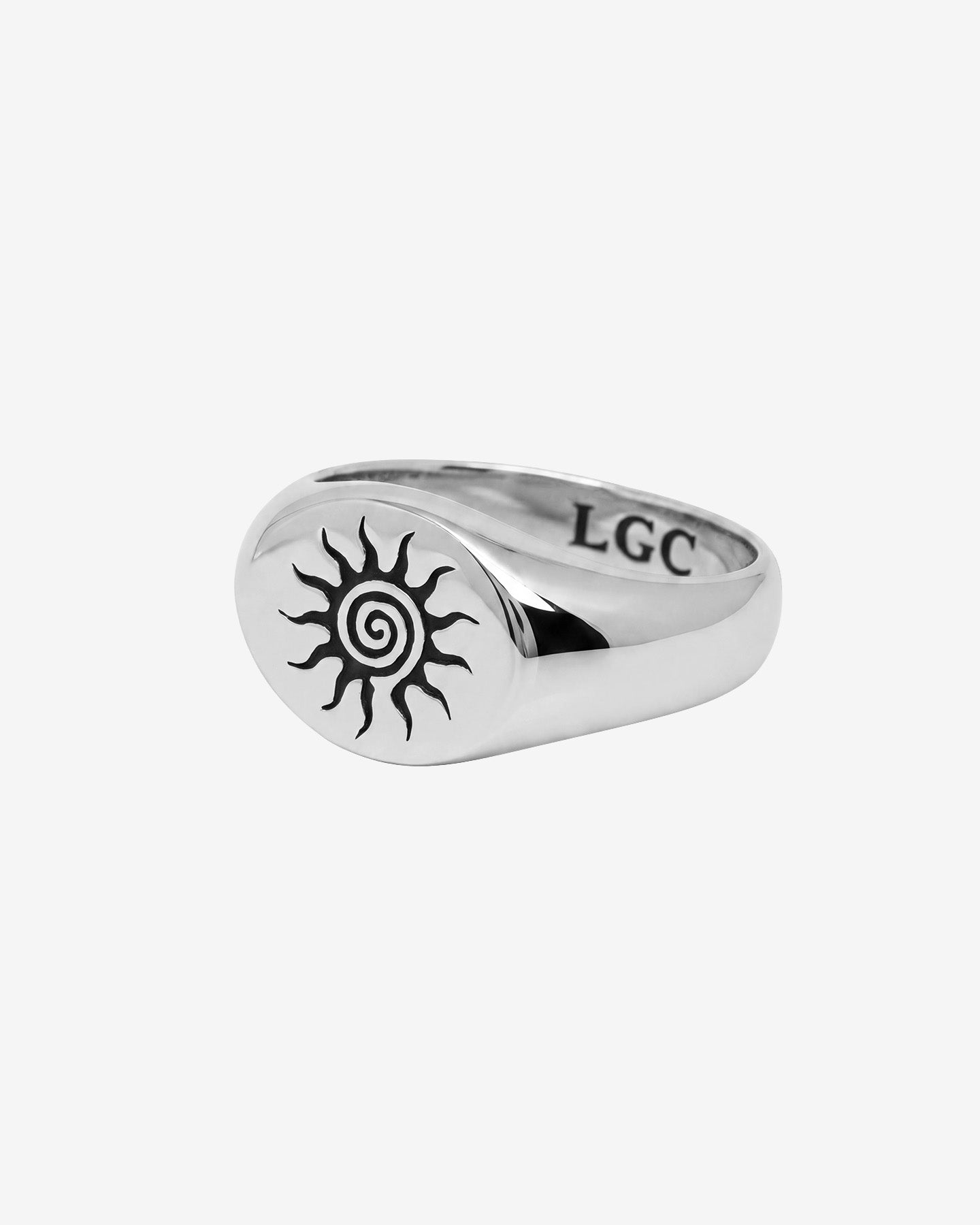 Energy silver ring featuring a sunburst and spiral motif on a wide band