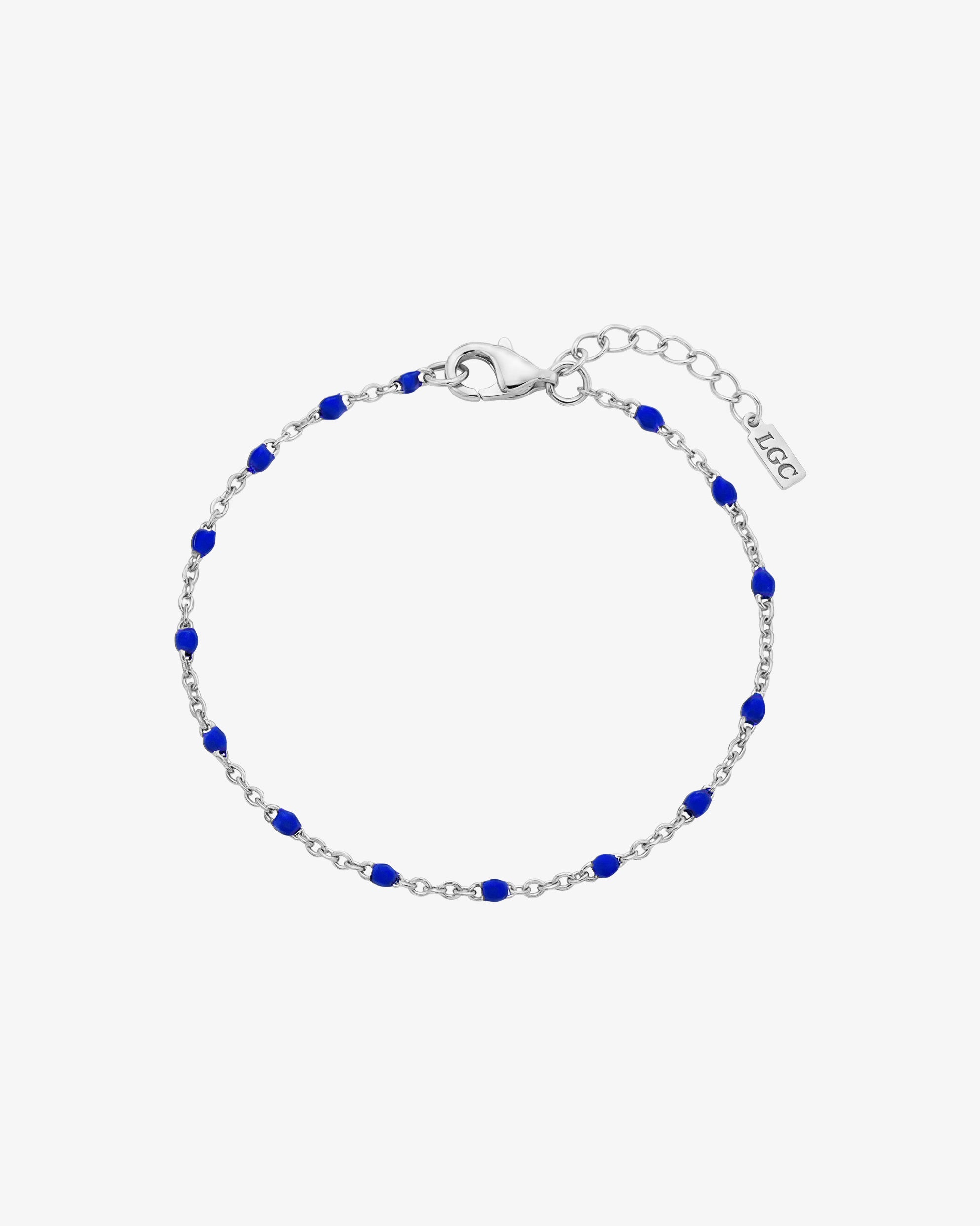 GEM silver bracelet with vivid blue beads along a silver chain and an adjustable lobster clasp
