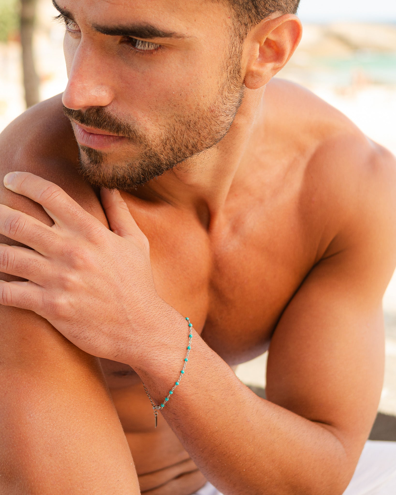 Silver GEM bracelet with turquoise beads worn on a man's wrist
