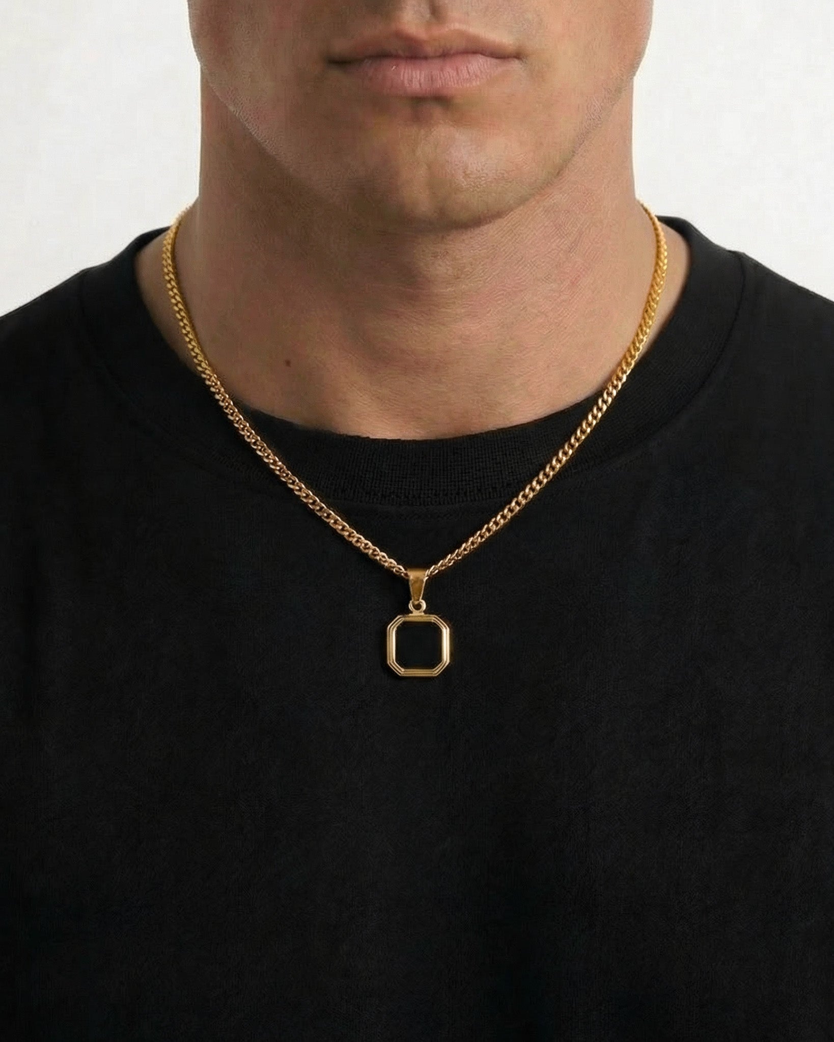 Nova Gold necklace with a small square pendant resting at the collarbone