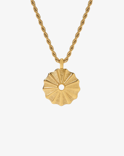 Gold rope chain necklace with a round sunburst pendant against a white background.