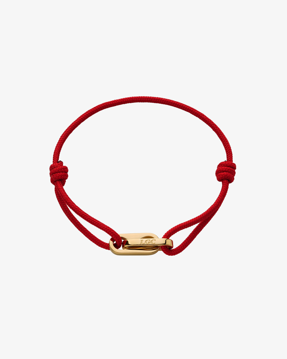 Atlantis gold bracelet with red cord and gold clasp on wrist