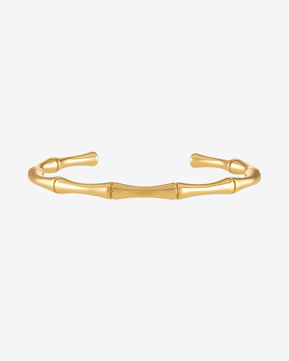 Gold bamboo bracelet with segmented links on a wrist.