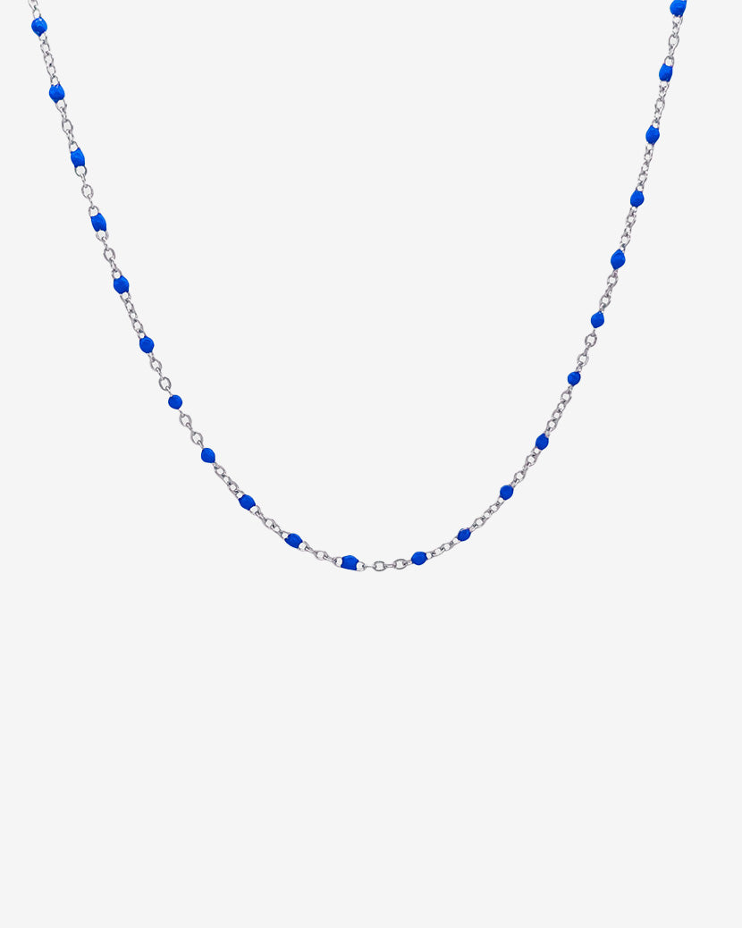 Gem silver chain necklace with evenly spaced blue beads along the chain