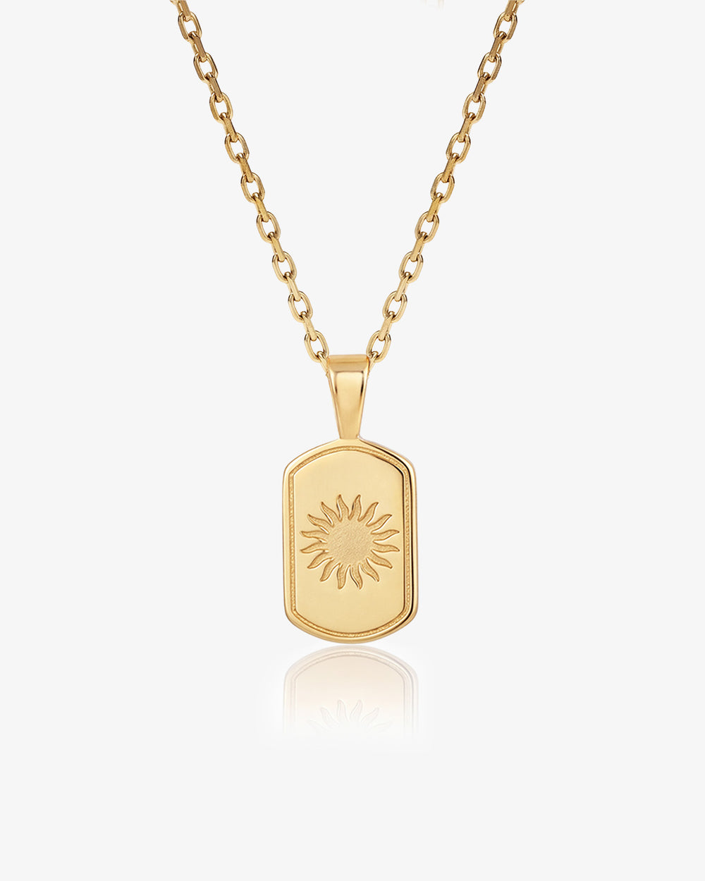 Daystar gold necklace with sunburst pendant on a gold chain.
