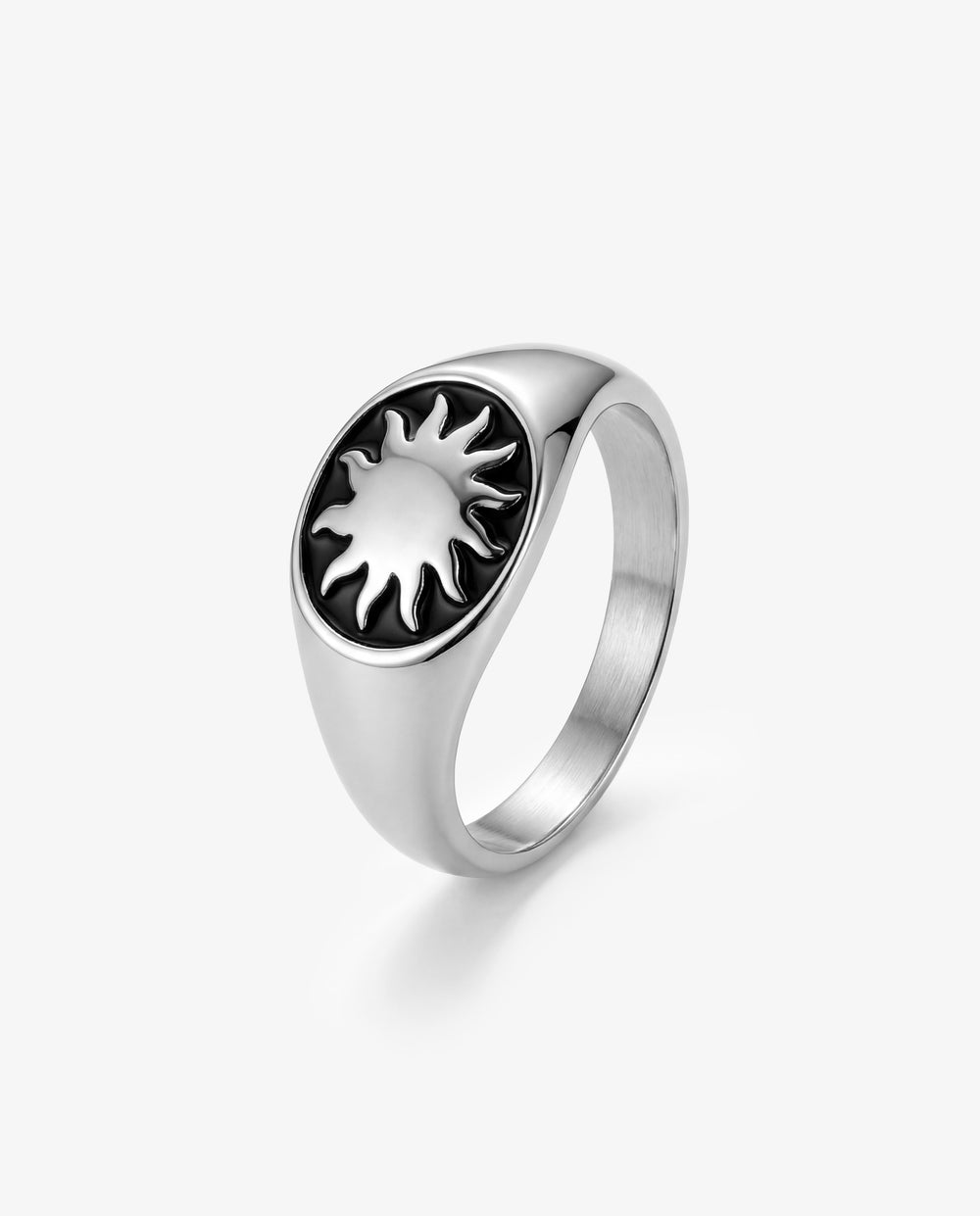 Daystar silver ring with a sunburst motif in black enamel on a smooth silver band.