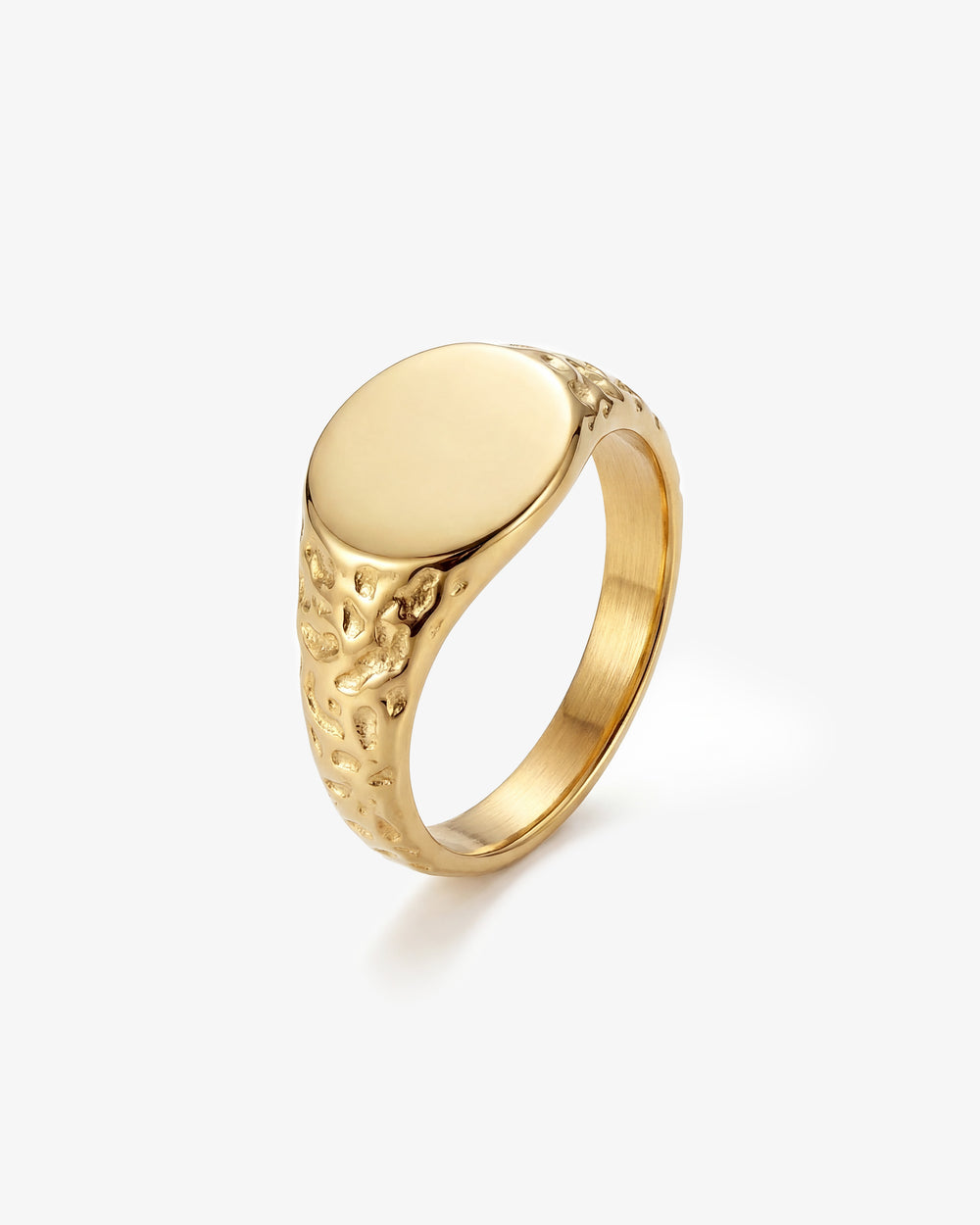 Eden Gold Ring with a smooth gold top and hammered textured band held by a hand