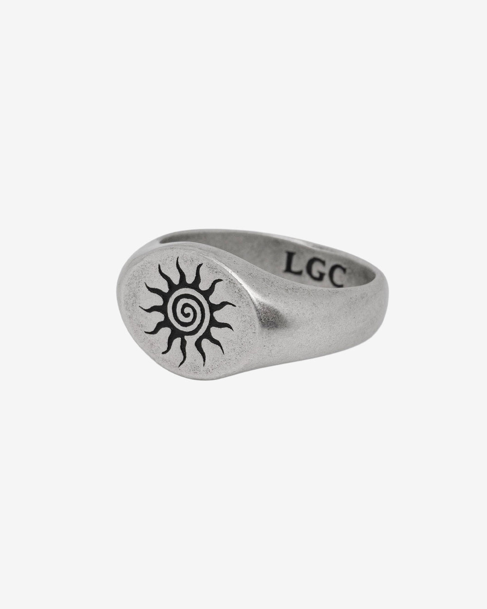 ENERGY SILVER RING with a sun spiral engraving on a brushed silver band on a white background