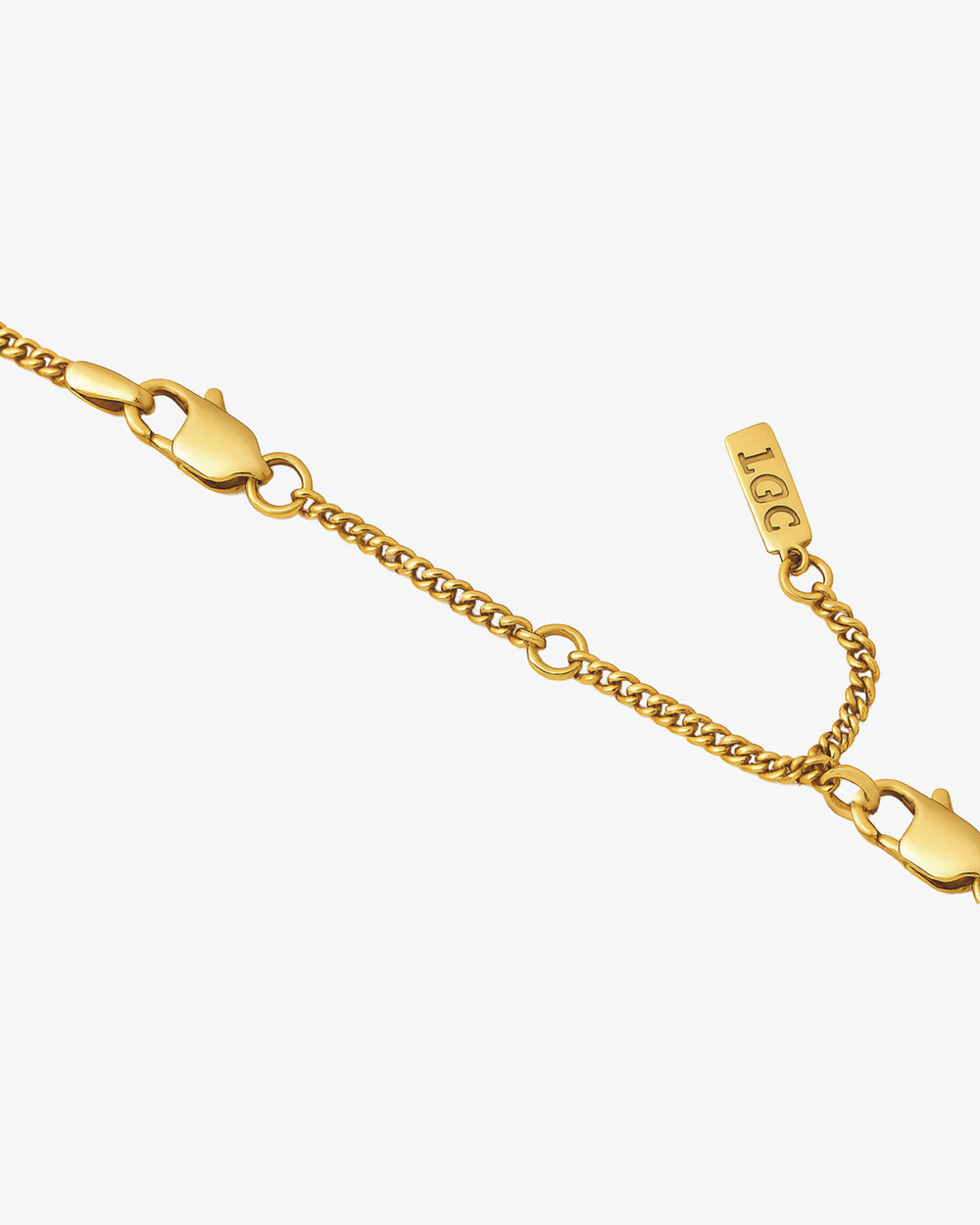 Eight centimeter gold extender chain with lobster clasp and small tag detail