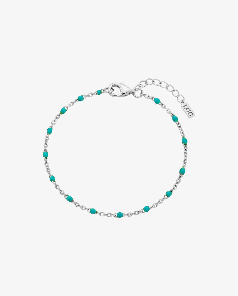 Silver bracelet with turquoise beads and a lobster clasp on a wrist