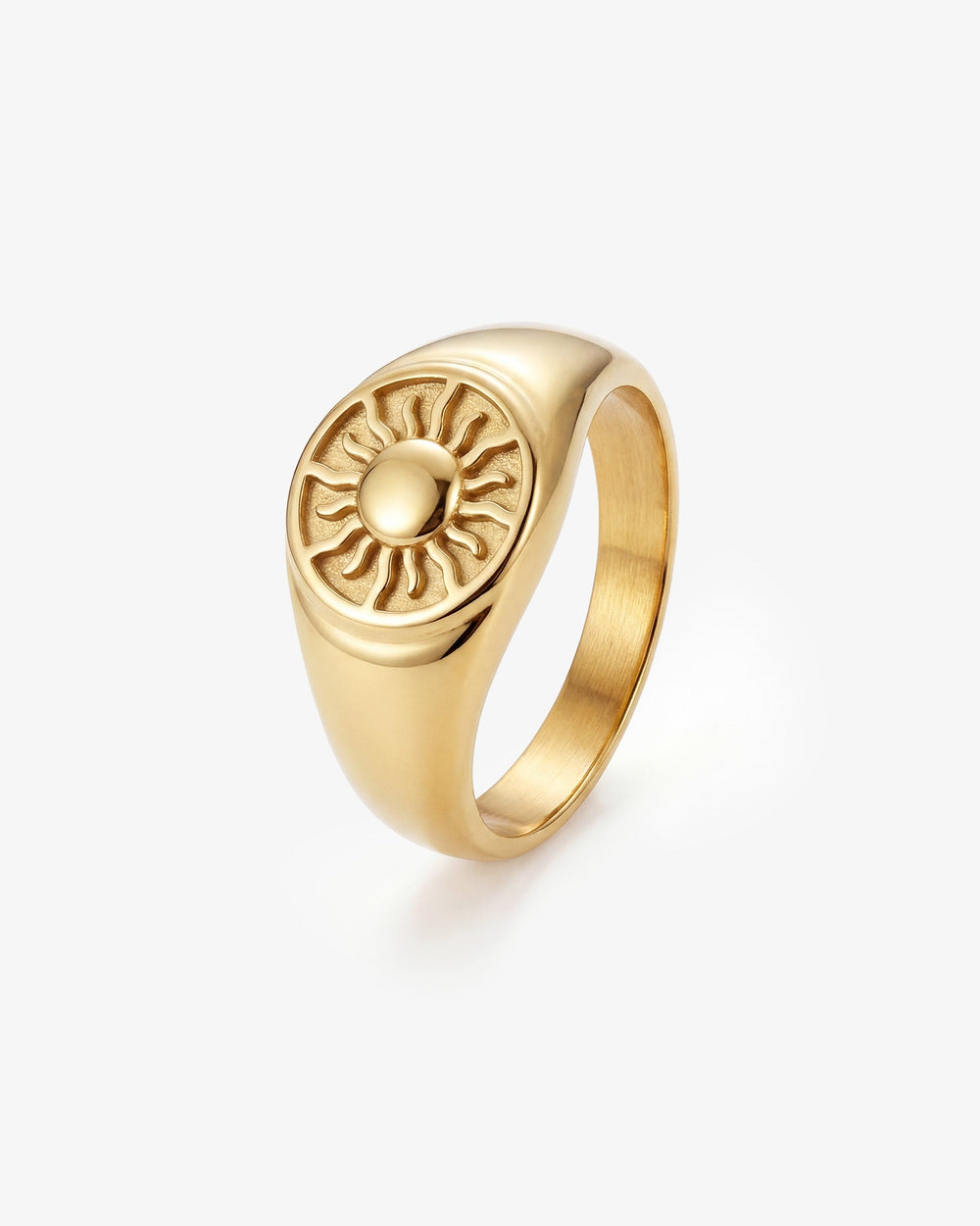 Gold ring with a sunburst design on a rounded bezel