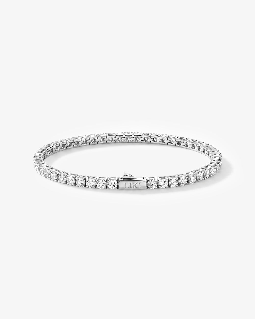 Silver tennis bracelet with a row of diamonds and an LGC engraved clasp