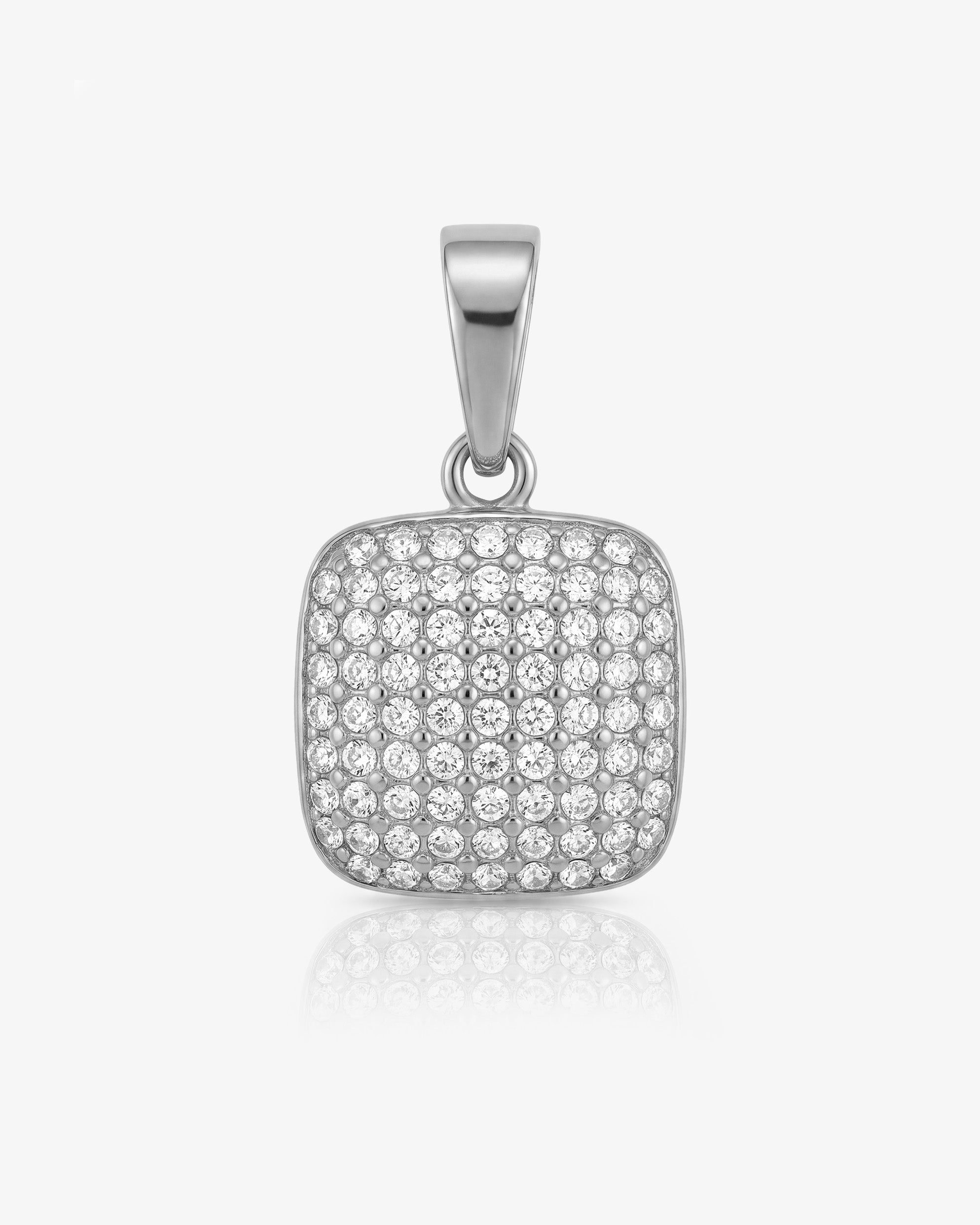 Charm MINI ICY con una gema roja rodeada de diamantes pavé sobre engaste de plata.