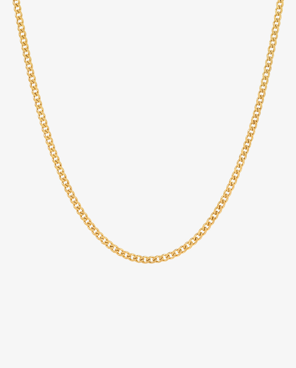 Close up of a minimalist 3 mm gold Cuban link chain