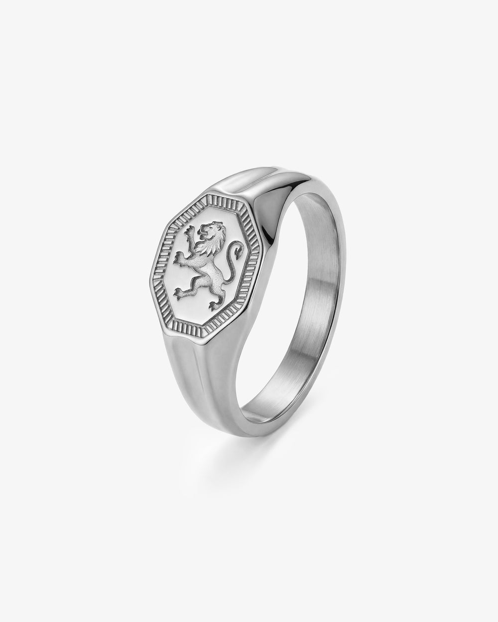 Legacy Silver Ring close up on finger featuring a shield shaped crest with a lion emblem