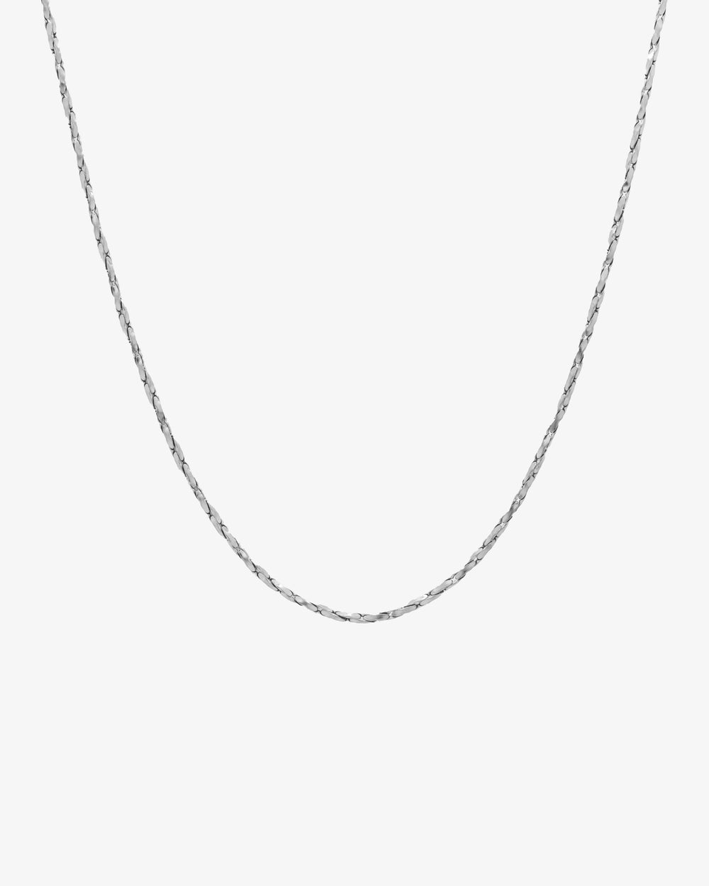 Silver LIRA chain with a minimal flat-link profile against a white background