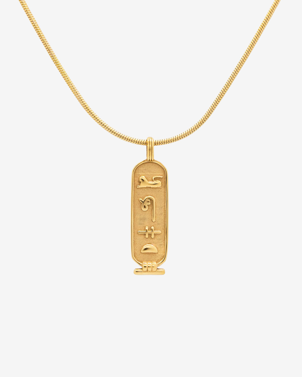 Luxor Gold Necklace close up with curved chain and rectangular pendant engraved with hieroglyphs