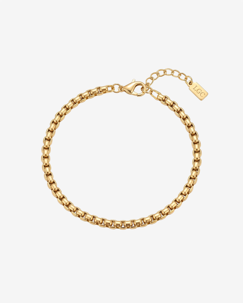 Noir Gold Bracelet close up showing chain links and a lobster clasp on a pale background