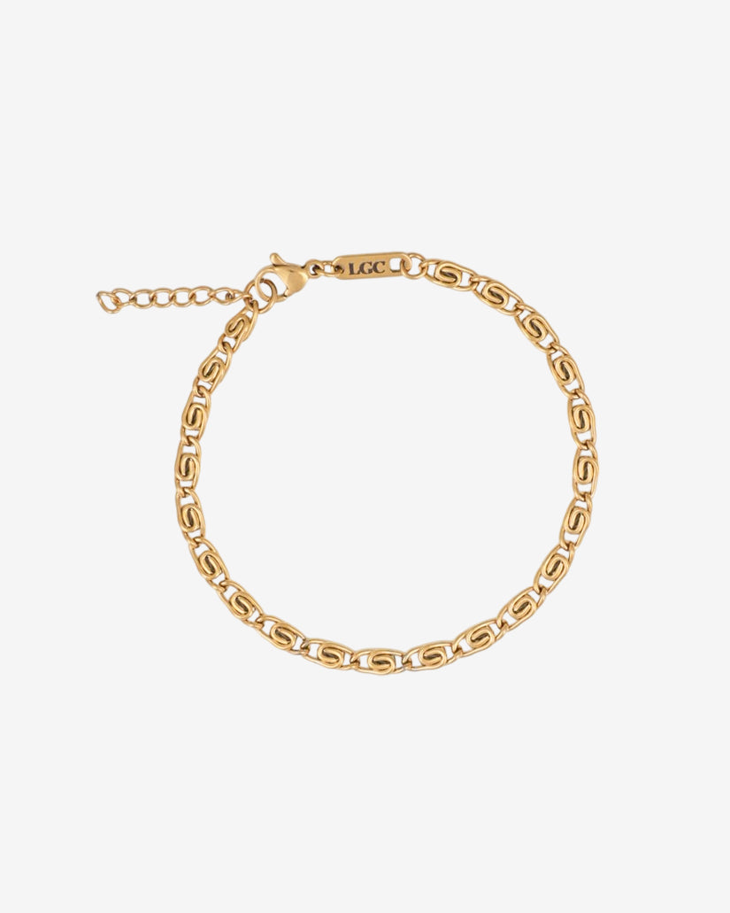 NUSA gold bracelet with chunky linked chain worn on the wrist against a white background