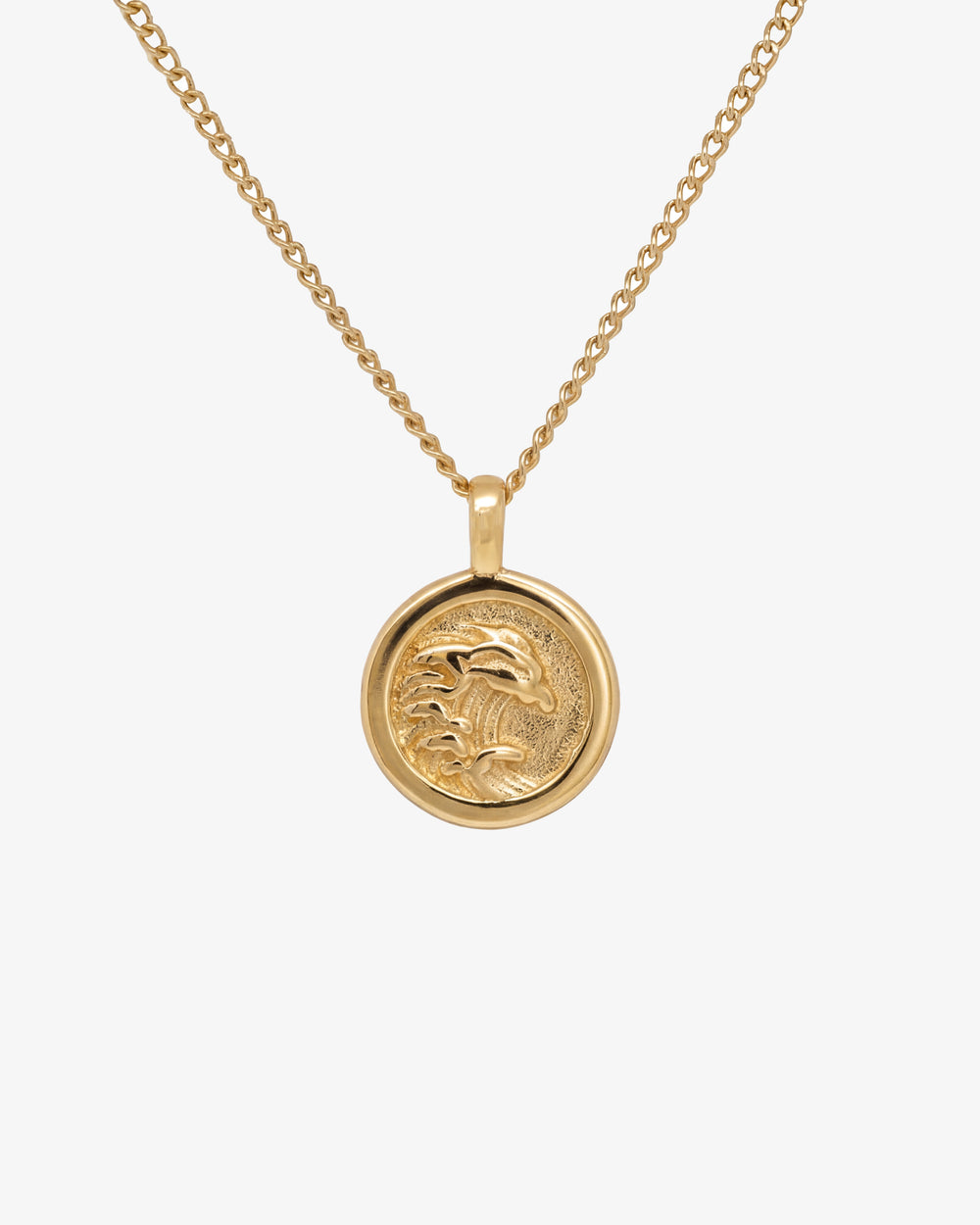 Gold OAHU necklace with a round palm tree pendant on a pale background