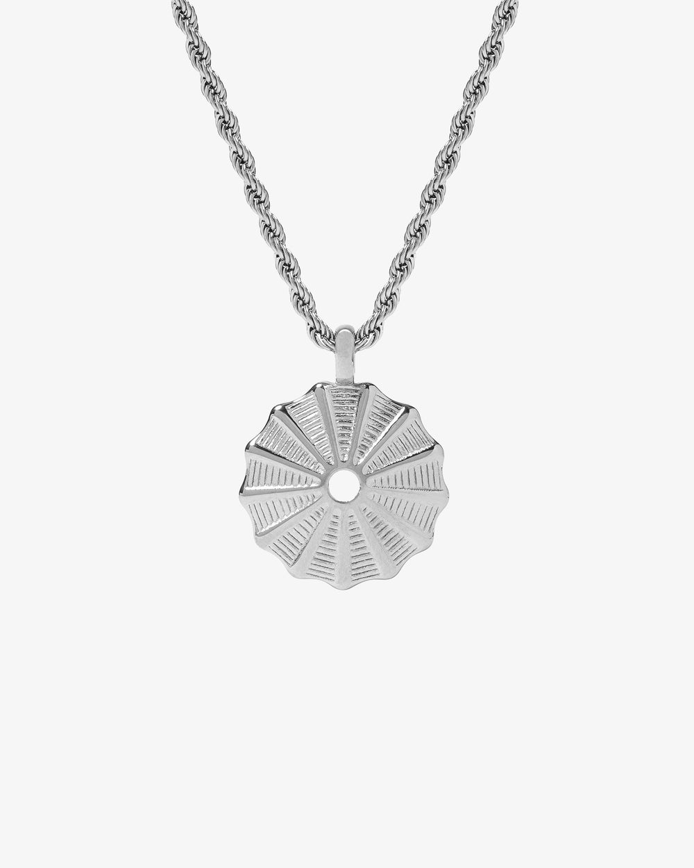 Silk Silver Necklace with a round sunburst pendant on a silver chain against white background.