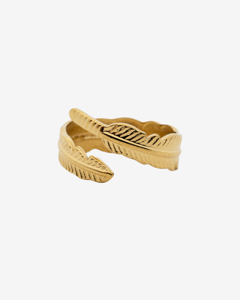 Close up of a Tahoe Gold Ring with a leaf textured edge on a white background