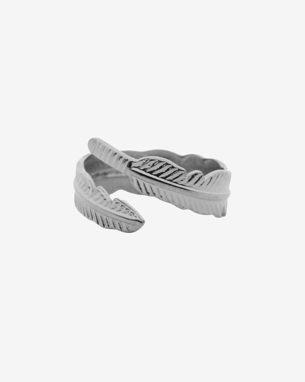 Close up of a twisted silver rope bracelet around a tattooed wrist