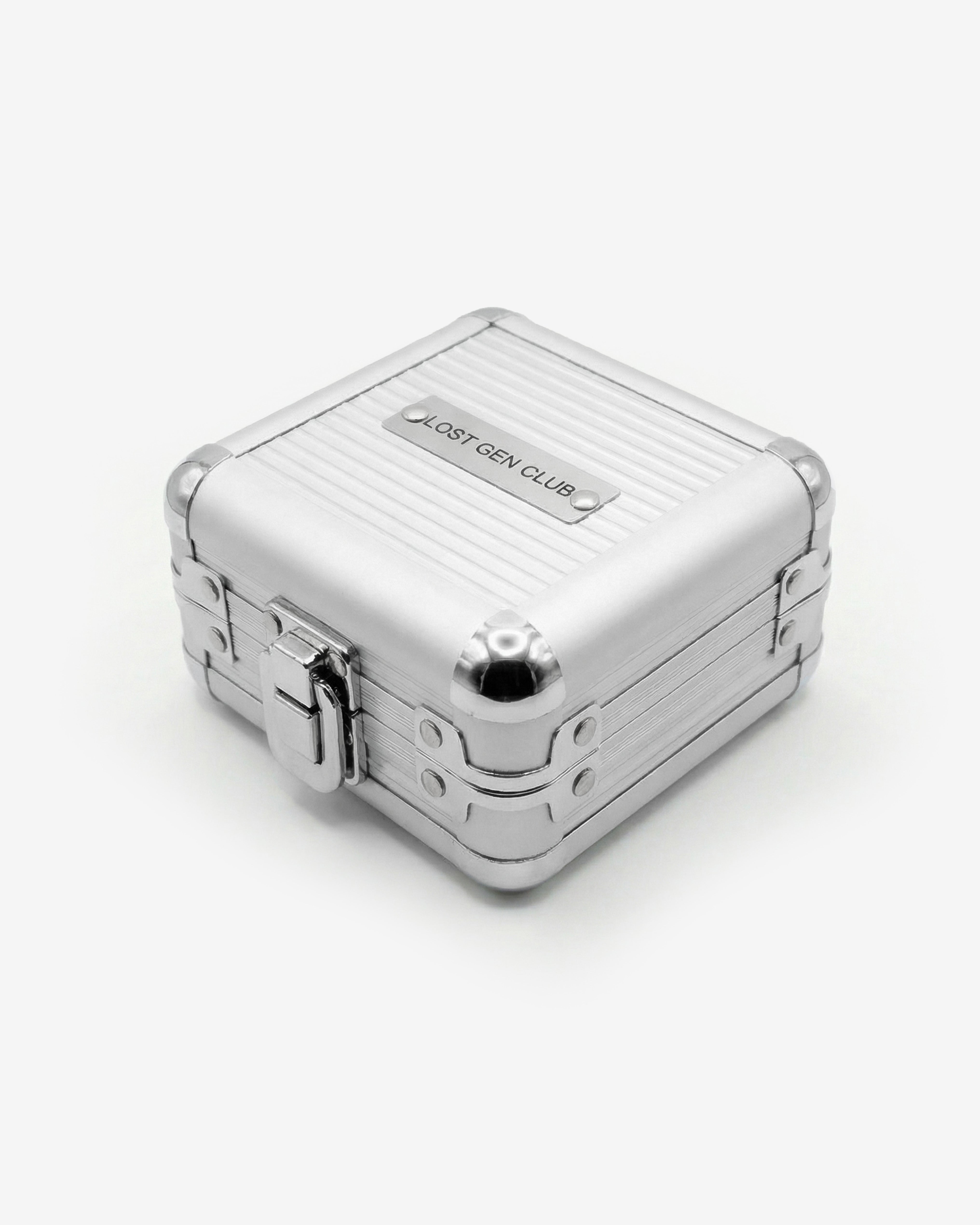 Lost Gen Club metal jewelry box opened to reveal compartments filled with assorted jewelry