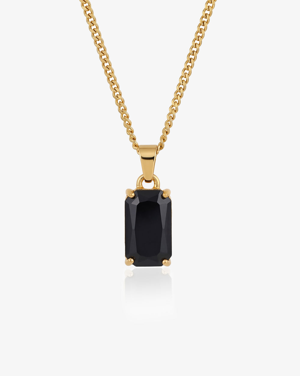 Gold chain necklace with a large black rectangular pendant against a white background