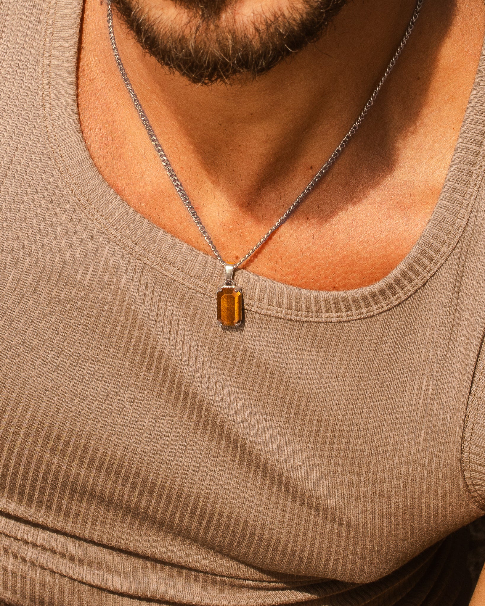 VOLT silver necklace with a silver bail and orange rectangular gemstone pendant